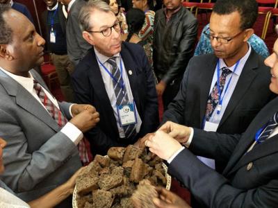 Delegates break bread at the launch of a new CGIAR research program