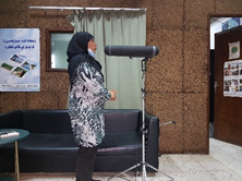 Female cooperative member recording a radio spot (Photographer: Udo Rudinger)