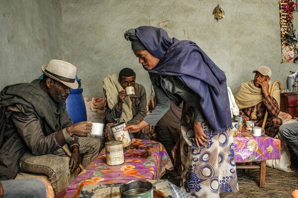 Woman selling Tella in the market