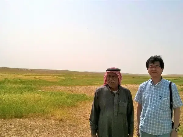 Jordanian rangeland farmer Mr. Ali Askar from Al Majeddyeh village with Prof. Tsunekawa of Tottori University (Japan) inspect a rainwater harvesting research site.