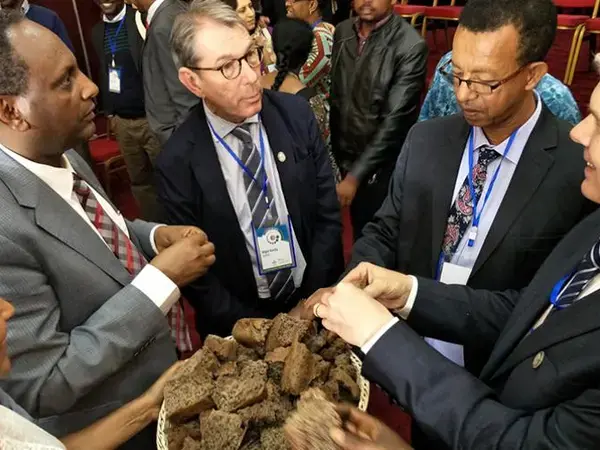 Delegates break bread at the launch of a new CGIAR research program