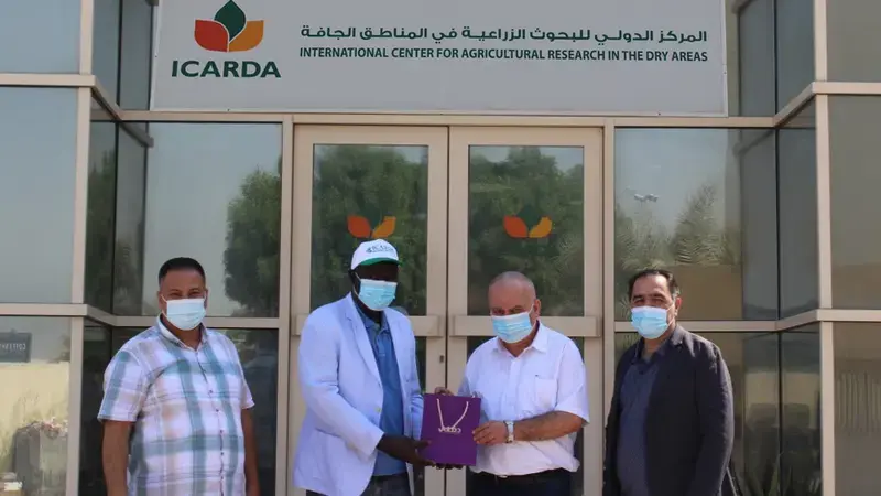 Dr. Abdoul Aziz Niane (center left), Dr. Azaiez Ouled Belgacem (center right)