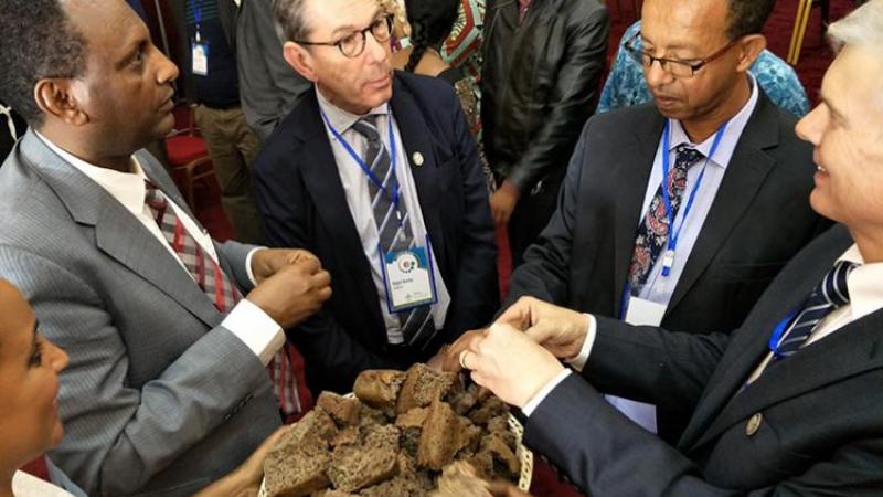 Delegates break bread at the launch of a new CGIAR research program