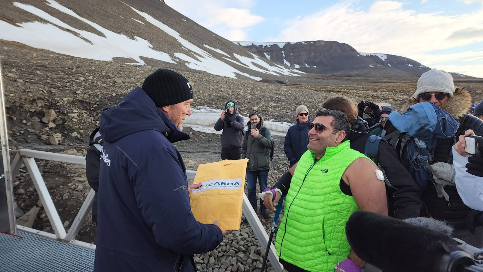 Michael Haddad delivering ICARDA seeds to Dr. Asmund Asdal at the Svalbard Global Seed Vault after completing his walk. Michael Haddad delivering ICARDA seeds to Dr. Asmund Asdal at the Svalbard Global Seed Vault after completing his walk.