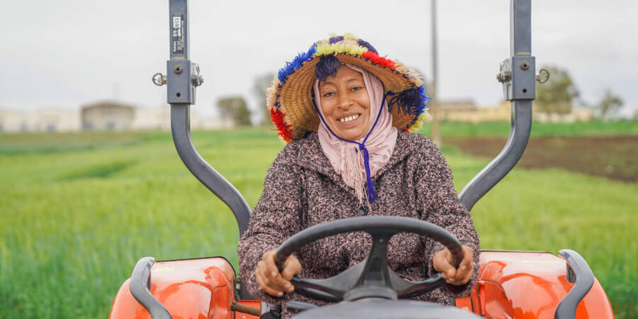 Smiling lady on tractor